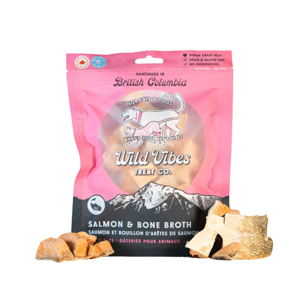 Pink package of Wild Vibes Treat Co. salmon and bone broth for pets with treats displayed in front at Harmony Pet Supplies, Scarborough.