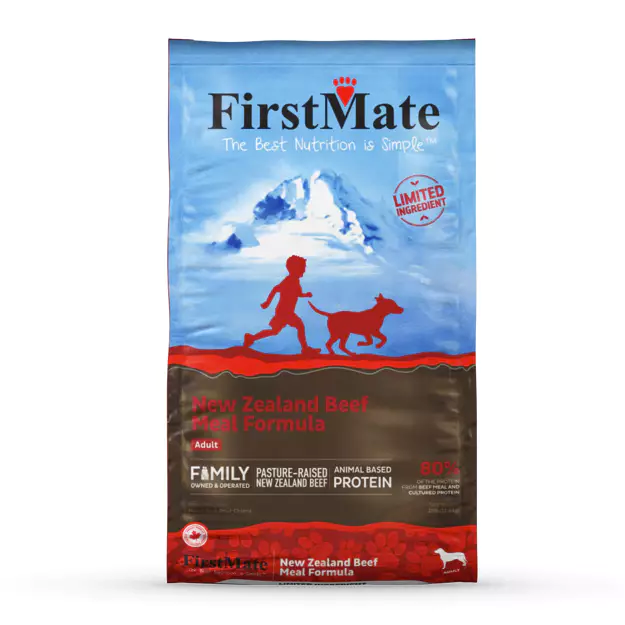 A bag of FirstMate dog food with a label showing a red silhouette of a child and a dog, and the text 'Limited Ingredient New Zealand Beef Formula'.
