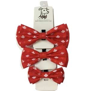 Set of three red bow ties with white patterns on a white background