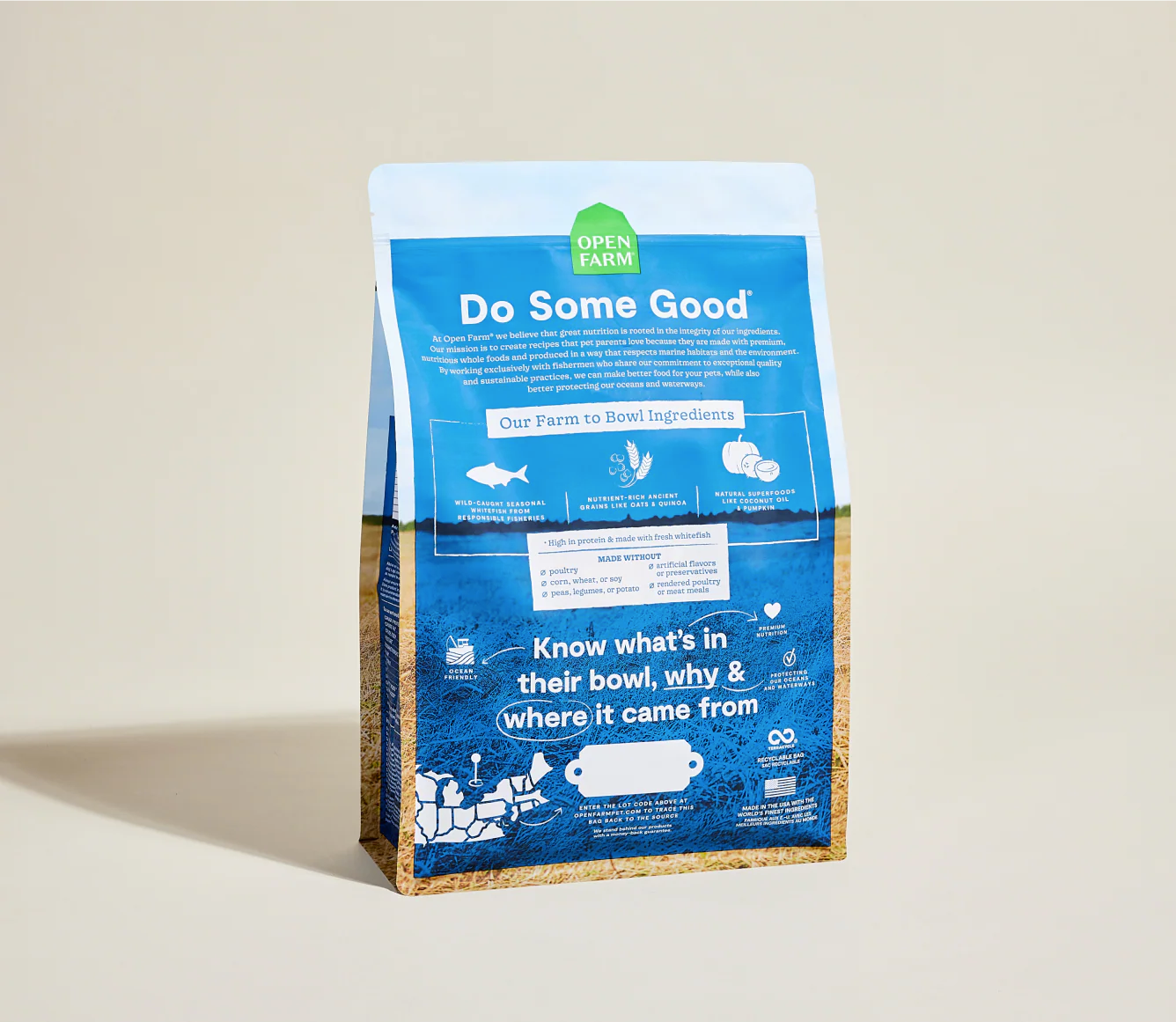 Open farm Dog food package with blue label on a beige background, back
