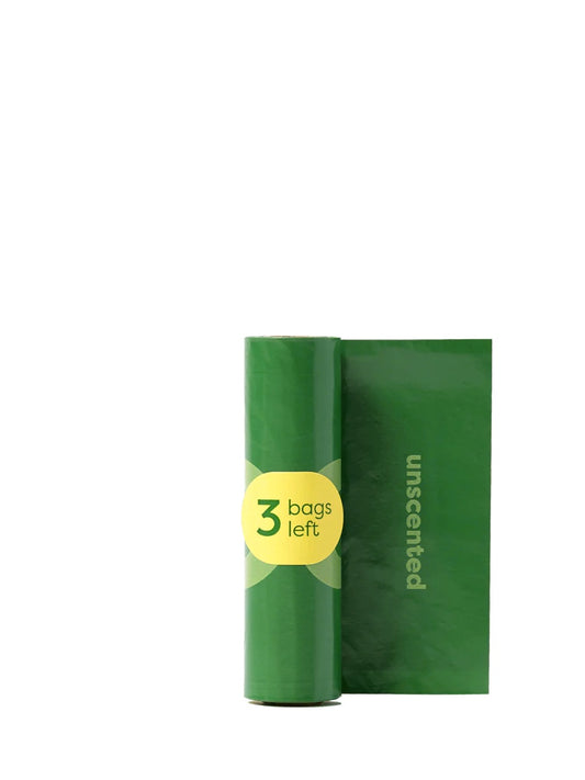 Harmony Pet Shop's green roll of earth rated dog poop bags with a yellow label indicating '3 bags left' on a white background, back.