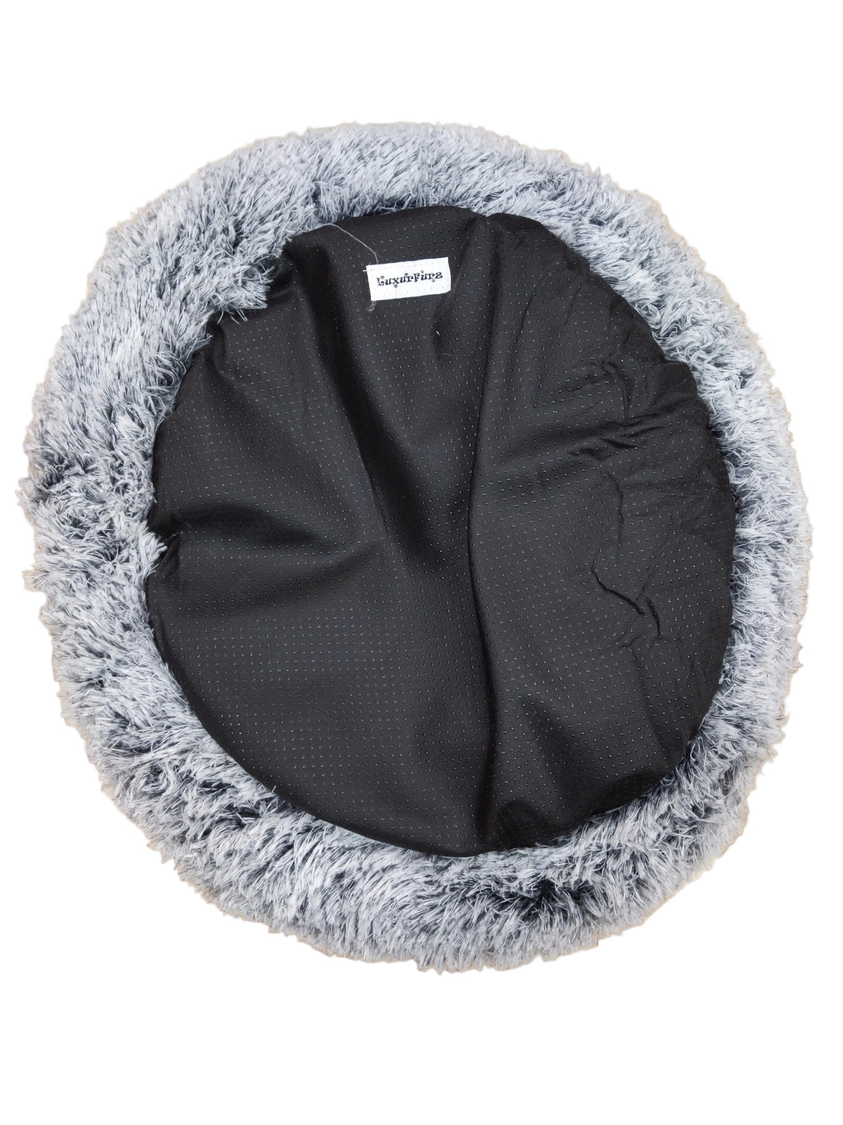 LuxurFurz Round pet bed with gray fluffy rim and black exterior base with firm grip on a wooden floor at Harmony Pet Supplies scarborough