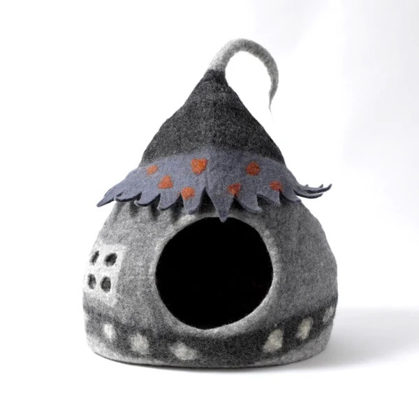 Gray pet house with a decorative flower on a white background