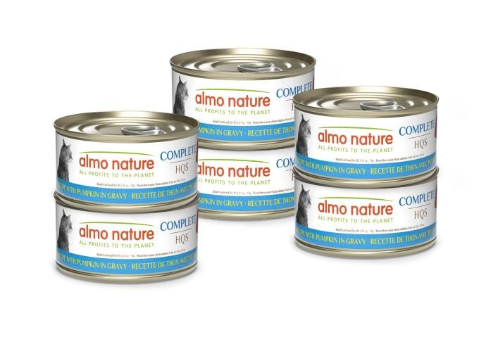 Six cans of Almo Nature cat food stacked on a white background
