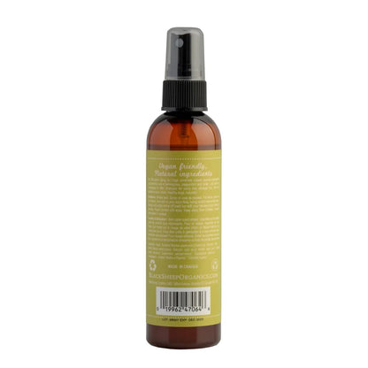 An amber glass spray bottle with a black spray top and a yellow-green label, shown from the back on a white background at Harmony Pet Supplies, Scarborough.