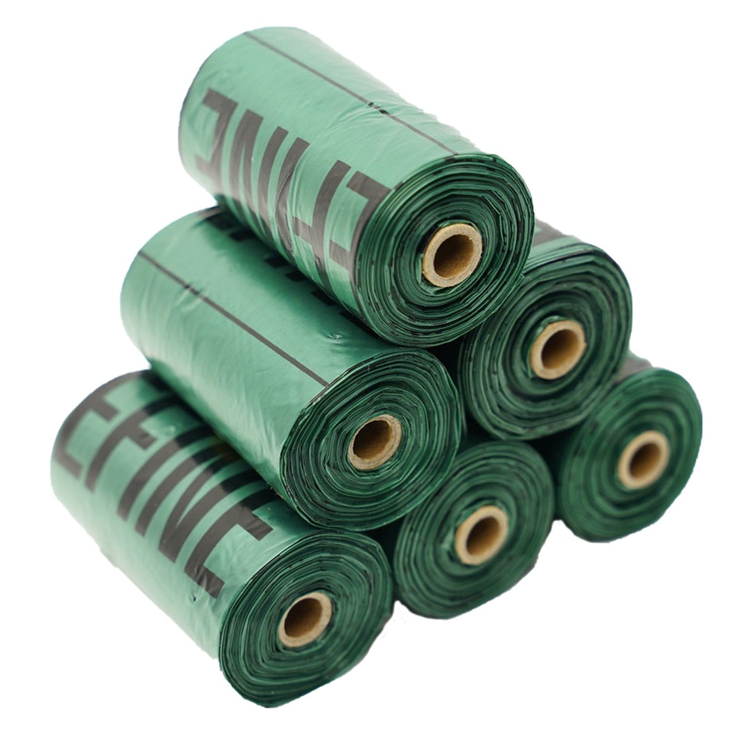 Stack of green rolls with Planet Grab n Go Roll branding on a white background at Harmony Pet Supplies Scarborough