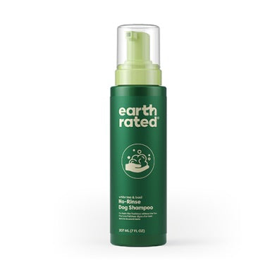 Green bottle of Earth Rated no-bleach dog shampoo on a white background