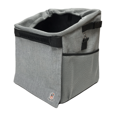 A gray mesh and fabric pet carrier basket with black trim, side straps, and a small orange and white logo patch on the front corner, shown on a plain white background at Harmony Pet Supplies, Scarborough.