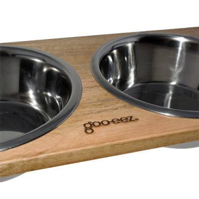 Goo-eez Stainless steel dog bowls on a wooden platform with 'goo eeez' branding at Harmony Pet Supplies Scarborough