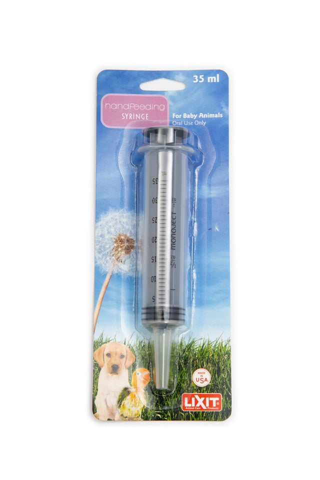 LIXIT syringe for baby animals in packaging with a dandelion and puppy illustration on a white background