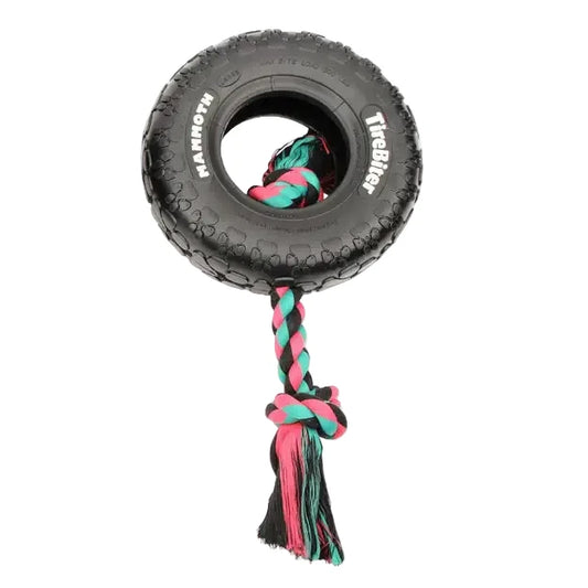 A black rubber tire dog toy with a braided pink, teal, and black rope handle, shown on a white background - Harmony Pet Supplies Scarborough.