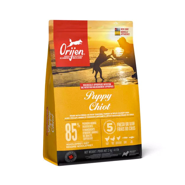 Orijen complete Puppy Chiot dog food package with sunset design on a white background. Harmony Pet Supplies, Scarborough, Pickering.