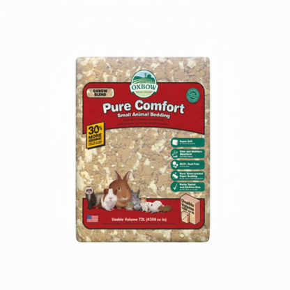 Oxbow Pure Comfort Small Animal Bedding in a square package, showing a beige wood shavings texture with cartoon rabbits and a blue 'BILINGUAL' banner overlay in the top left corner.