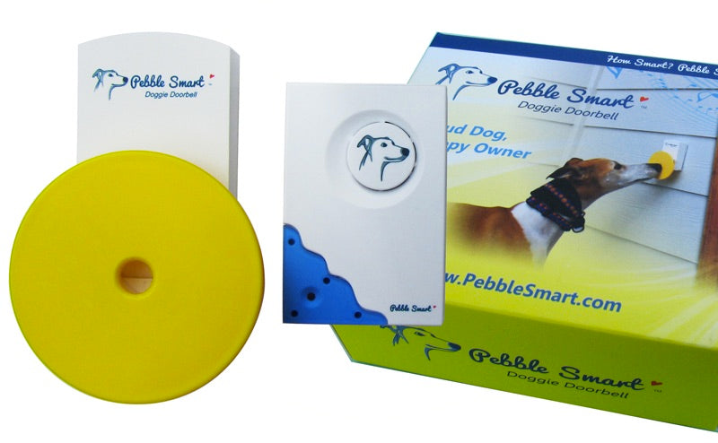Pebble Smart doggie doorbell components including a yellow disc and packaging with branding.