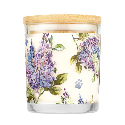 Candle with floral design and wooden lid on a white background