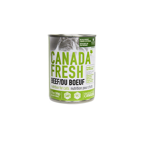 A can of Canada Fresh Beef/Du Boeuf wet cat food, featuring a white and green label with a cat's face at the top, set against a plain white background at Harmony Pet Supplies, Scarborough.