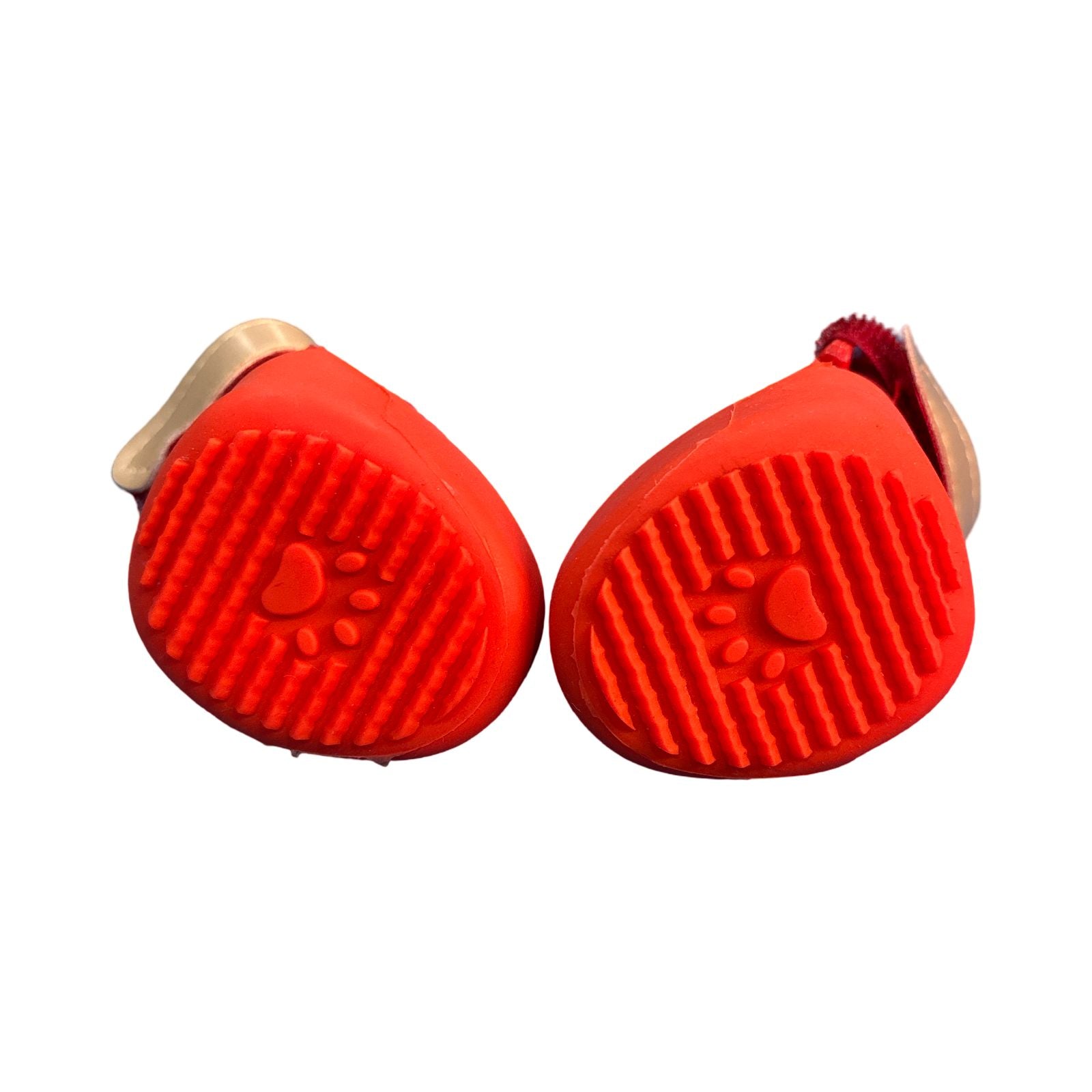 Two red pet grooming petgen Z with a paw print design on a white background