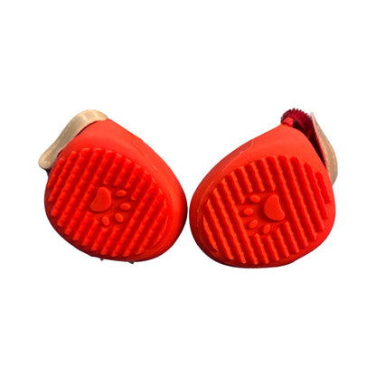 Two red pet grooming petgen Z with a paw print design on a white background