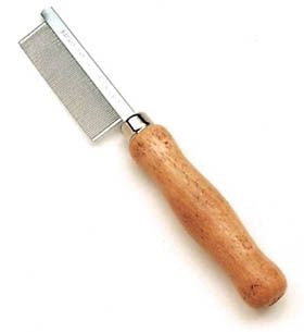 Pet grooming comb with wooden handle on a white background