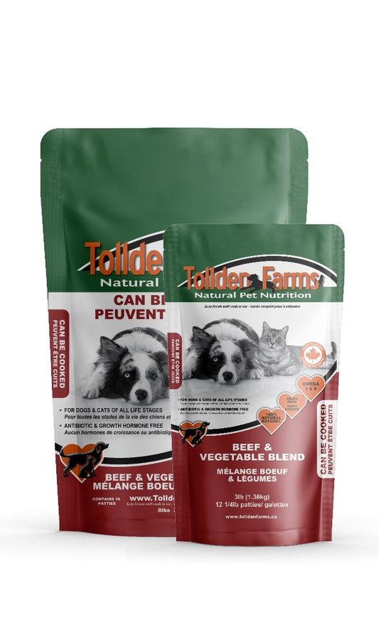 Two packages of Tollden Farms natural pet food on a white background