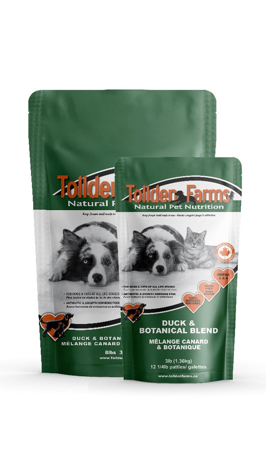 Two packages of Tollden Farms natural pet nutrition of Duck and Botanical pet food on a white background
