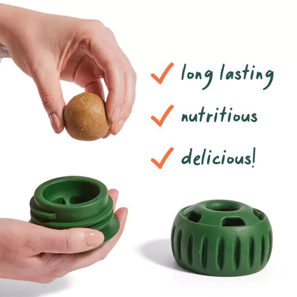Green woof dog toy container with a small pupsicle treat, hands holding it, and text highlighting benefits on a white background at Harmony Pet Supplies, Scarborough
